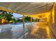Covered patio featuring a pool, spa, and green landscaping at 386 Wiseton Ave, Las Vegas, NV 89183