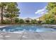 This backyard features a pool with a spa, mature landscaping, and plenty of privacy at 386 Wiseton Ave, Las Vegas, NV 89183