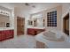 Primary bathroom with dual sinks, soaking tub, and a separate shower at 386 Wiseton Ave, Las Vegas, NV 89183
