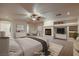Spacious bedroom featuring a fireplace, ceiling fan and neutral tones, creating a serene retreat at 386 Wiseton Ave, Las Vegas, NV 89183