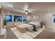 Staged bedroom with a ceiling fan, carpet, and natural light at 386 Wiseton Ave, Las Vegas, NV 89183