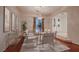 Bright dining room featuring modern furnishings, chandelier lighting, and a view to the front entry way at 386 Wiseton Ave, Las Vegas, NV 89183