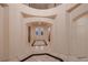 Elegant foyer boasts high ceilings, marble flooring, arched doorways, and decorative glass double doors at 386 Wiseton Ave, Las Vegas, NV 89183