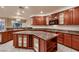Gourmet kitchen with custom cabinetry, granite countertops, stainless steel appliances, and a central island at 386 Wiseton Ave, Las Vegas, NV 89183