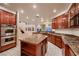 Open kitchen featuring stainless steel appliances, granite counters, and an island with breakfast bar at 386 Wiseton Ave, Las Vegas, NV 89183