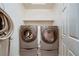 The laundry room features side-by-side washer and dryer units with a shelf above at 386 Wiseton Ave, Las Vegas, NV 89183