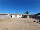 Overview of a backyard featuring a covered patio, a storage shed, and minimal landscaping in a desert climate at 4321 El Conlon Ave, Las Vegas, NV 89102
