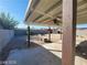 Covered patio overlooking a spacious backyard with a block wall, a small shed, and sparse greenery at 4321 El Conlon Ave, Las Vegas, NV 89102