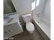 Bathroom featuring a toilet, modern sink with white cabinet, and combined bathtub and shower at 4321 El Conlon Ave, Las Vegas, NV 89102