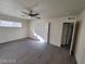 This bedroom features hardwood floors, neutral paint, a ceiling fan and multiple closet doors for storage at 4321 El Conlon Ave, Las Vegas, NV 89102
