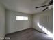 Comfortable bedroom with new hard wood floors, a ceiling fan, natural light and a closet at 4321 El Conlon Ave, Las Vegas, NV 89102