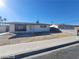 Exterior shot showcasing a single-story home with a low-pitched roof, a small yard, and desert landscaping at 4321 El Conlon Ave, Las Vegas, NV 89102