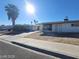 Single-story home featuring a palm tree, a driveway, and low-maintenance landscaping on a sunny day at 4321 El Conlon Ave, Las Vegas, NV 89102
