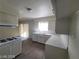 Bright kitchen with a gas cooktop, white cabinets, and modern countertops at 4321 El Conlon Ave, Las Vegas, NV 89102
