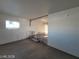 Spacious living room with hardwood floors and plenty of natural light from the large window at 4321 El Conlon Ave, Las Vegas, NV 89102