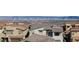 An elevated view overlooking a neighborhood and a city skyline in the distance at 436 Crown Mesa Ave, Las Vegas, NV 89138