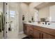Elegant bathroom with a double vanity, modern fixtures, and a separate toilet room at 436 Crown Mesa Ave, Las Vegas, NV 89138