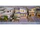 Charming two-story home with desert landscaping and a gray garage door at 436 Crown Mesa Ave, Las Vegas, NV 89138