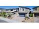Stylish two-story home featuring a modern garage door and landscaped front yard at 436 Crown Mesa Ave, Las Vegas, NV 89138