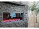 Contemporary electric fireplace with a stone surround and blue accents at 436 Crown Mesa Ave, Las Vegas, NV 89138