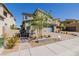 Stylish modern home with a gray roof, a gray two-car garage, and manicured drought-tolerant landscaping at 436 Crown Mesa Ave, Las Vegas, NV 89138