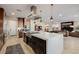 Open-concept kitchen with a large island, stainless steel appliances, and modern finishes at 436 Crown Mesa Ave, Las Vegas, NV 89138