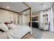 Beautiful bedroom featuring a four poster bed, balcony access, and a stylish accent chair at 436 Crown Mesa Ave, Las Vegas, NV 89138
