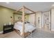 Comfortable main bedroom with a four poster bed and neutral walls at 436 Crown Mesa Ave, Las Vegas, NV 89138
