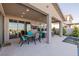 Outdoor patio area with ample seating, a ceiling fan, and a view of the pool at 436 Crown Mesa Ave, Las Vegas, NV 89138