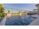 Relaxing pool area with stone accents, lush foliage, and a serene ambiance at 436 Crown Mesa Ave, Las Vegas, NV 89138