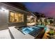 Backyard pool and spa with lush landscaping and outdoor lighting at 436 Crown Mesa Ave, Las Vegas, NV 89138