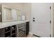 Elegant wet bar with wine storage and contemporary countertop at 436 Crown Mesa Ave, Las Vegas, NV 89138