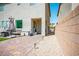 Private backyard includes brick pavers, a patch of artificial grass, and stylish patio furniture at 4634 Observed St, North Las Vegas, NV 89031