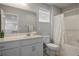 Neutral bathroom featuring a single sink vanity, toilet, and shower with shower curtain at 4634 Observed St, North Las Vegas, NV 89031