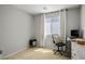 Bedroom with gray walls, carpeted floor, a computer desk and a black office chair at 4634 Observed St, North Las Vegas, NV 89031