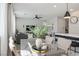 Bright dining area with a glass table, modern chairs, and view of the living room, perfect for gatherings at 4634 Observed St, North Las Vegas, NV 89031