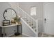 Light-filled foyer with staircase, modern decor, and stylish accents, creating an inviting entrance to the home at 4634 Observed St, North Las Vegas, NV 89031