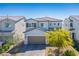 A beautiful two-story home with a welcoming facade, manicured landscaping, and a spacious two-car garage at 4634 Observed St, North Las Vegas, NV 89031