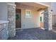 Welcoming front porch featuring stone accents, a decorative wreath, and a paved entryway for a cozy curb appeal at 4634 Observed St, North Las Vegas, NV 89031