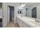 Bright bathroom featuring double sinks and a separate shower and toilet area at 472 Via Stretto Ave, Henderson, NV 89011