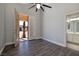 Bright bedroom featuring wood-look floors, and a view to the backyard and bathroom at 472 Via Stretto Ave, Henderson, NV 89011