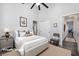 Comfortable bedroom featuring soft carpets, neutral colors, and access to the bathroom at 472 Via Stretto Ave, Henderson, NV 89011