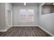 Inviting bedroom with wood floors, large windows with shutters allowing ample natural light at 472 Via Stretto Ave, Henderson, NV 89011
