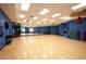 Spacious dance studio with wood floors, mirrors, and ample room for exercise at 472 Via Stretto Ave, Henderson, NV 89011