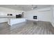 Open floor plan kitchen and living room with fireplace and modern finishes at 472 Via Stretto Ave, Henderson, NV 89011