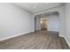 Bright living room with hardwood floors, neutral paint, and an arched entryway at 472 Via Stretto Ave, Henderson, NV 89011