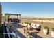 Spacious rooftop deck offering city views, lounge seating, and a dining area at 472 Via Stretto Ave, Henderson, NV 89011