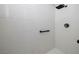 Modern shower with white tile, sleek fixtures, and a handrail at 472 Via Stretto Ave, Henderson, NV 89011