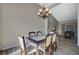 Dining room with chandelier lighting and view to the living room at 4773 Sarazen Cir, Las Vegas, NV 89103