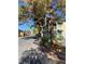 Charming exterior featuring balconies, awnings, and mature landscaping for a welcoming appeal at 520 Elm Dr # 202, Las Vegas, NV 89169